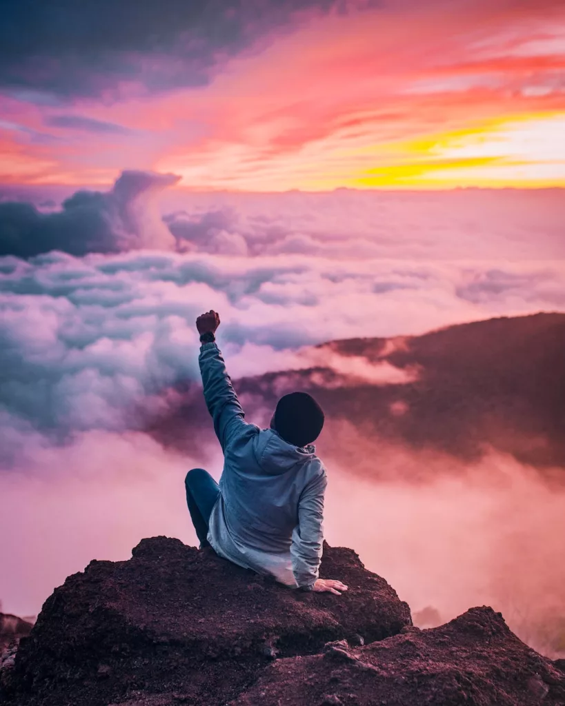 Man looking at beautiful sky and mountain ranges