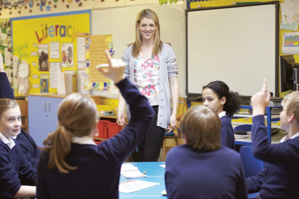 teacher instructing a class using the professional development topics.